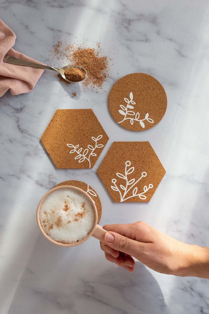 Floral Cork Coasters SVG | DIY Cricut Cut File (Instant Download) displayed with a coffee cup and decorative cork coasters.
