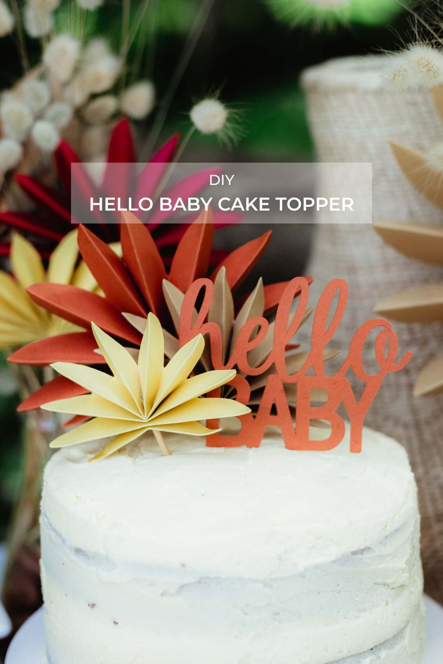 Hello Baby Cake Topper | Boho Baby Shower Decor (DIY) on a beautiful cake with colorful floral accents.