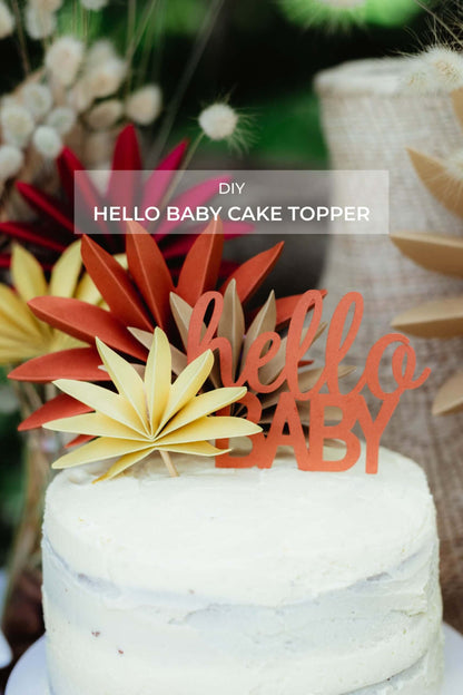 Hello Baby Cake Topper | Boho Baby Shower Decor (DIY) on a beautiful cake with colorful floral accents.