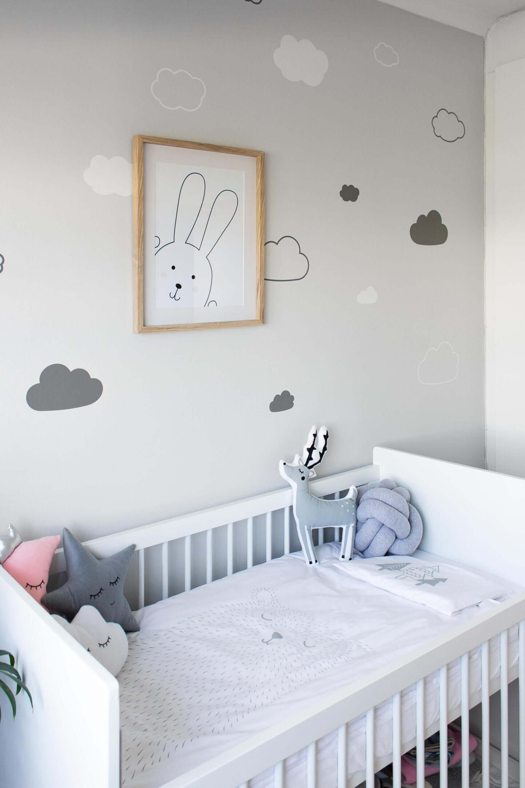 Cloud Wall Decals SVG | Gender Neutral Nursery Decor (Digital Download) in a cozy nursery with a crib.